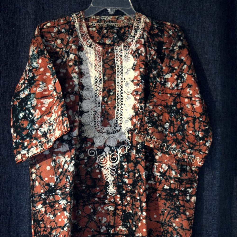 men's shirt, orange and black pattern, hand stitching